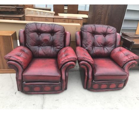 TWO RED LEATHER BUTTON BACK ARMCHAIRS 