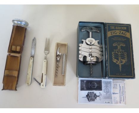 An AB Nordiska Kompaniet of Stockholm travel bottle opener and corkscrew, a Zig-Zag Tire Bouchion corkscrew, a travelling din