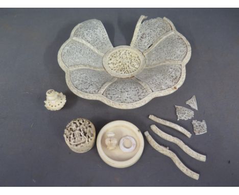 An Oriental ivory bowl, an ivory trinket or pill box and various other ivory pieces 