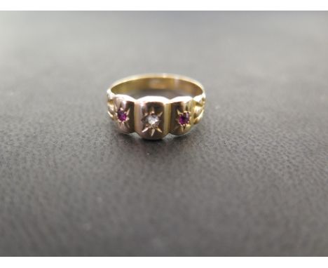 An 18ct gold ruby and diamond scalloped ring - Partial hallmark - Ring size L 1/2 - Weight approx 1.8gms 
Condition Report: G