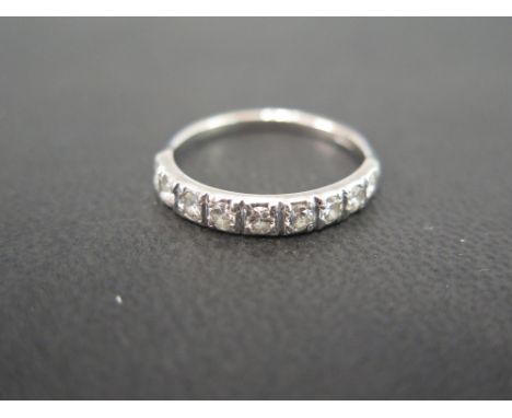 An 18 ct white gold and diamond half eternity ring - set with nine round cut diamond each approx. 3 points - Ring size N 1/2 