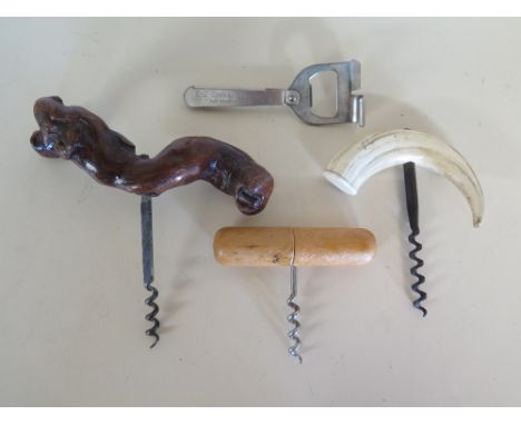 A French BTE S.G.D.G. picnic corkscrew, an E-Z cork puller, a wooden handled corkscrew and a Boar's tooth handled corkscrew