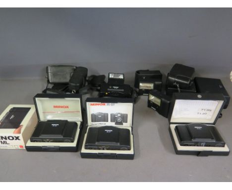 A collection of Minox cameras and accessories to include three boxed Minox cameras 35 EL, 35 ML and 35 GT . 4 Minox camera ca