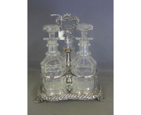 An ornate 19th century Sheffield plate decanter stand with a set of three Victorian cut glass mallet shape decanters
Conditio