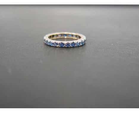 A late 19th/early 20th century 9 ct gold and silver sapphire set eternity ring set with 22 stones - Ring size L 1/2
Condition