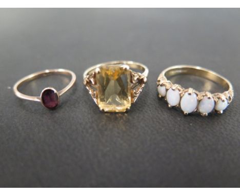 Three 9 ct gold dress rings to include a five stone opal size N, a rose gold and amethyst - Ring size I and a gold ring set w