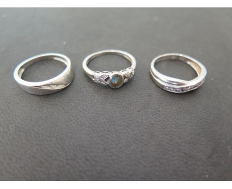 Three 9 ct white gold dress rings - one set with possibly a Topaz and small diamonds - Ring sizes O and P - Weight approx. 6 