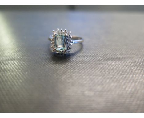 An 18ct gold paraiba tourmaline and diamond cluster ring - Hallmarked Birmingham - Ring size L - Weight approx 3.7gms
Conditi