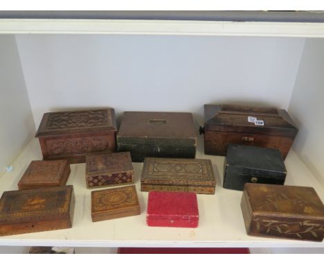 A collection of eleven boxes including jewellery boxes, a carved wooden box and a tea caddy