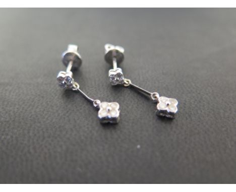 A pair of 18ct gold brilliant-cut diamond floral cluster ear pendants - Hallmarked London - Length 2.3cms - Weight approx 3.1