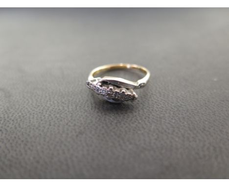 A single-cut diamond crossover style panel ring - Stamped 18ct plat - Ring size M 1/2 - Weight approx 3.7gms
Condition Report