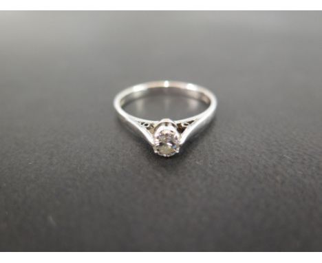 An 18 ct white old-cut diamond solitaire ring - the stone measuring 0.25 ct set in an open claw setting - Ring size M 1/2
Con