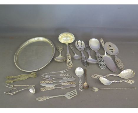 A selection of Norwegian silver items including salva, serving spoons, ladle, pickle fors and knives, teaspoons etc. all mark