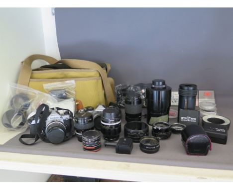 A Billingham camera bag containing Nikon FE and FM bodies, Nikkor 28 mm, micro 55 mm, 105 mm lenses and eight other Nikon acc