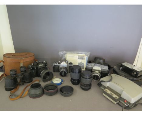 A collection of vintage cameras and lenses including Pentax SIA, Mamiya Auto- Lux 35, Zenit 11, a Carl Zeiss S1:3.5 lens, a P