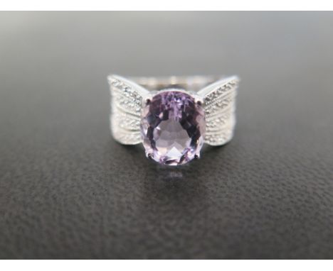 A 9 ct white gold dress ring set with diamond and pink topaz - the Topaz measures 11 mm x 9 mm approx. - 32 small diamonds se