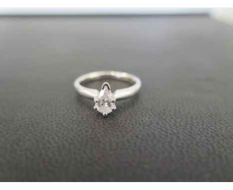 A diamond single-stone ring - The pear-shape diamond to the plain band -  diamond size approx 8 x 5 mm - Estimated I-J colour