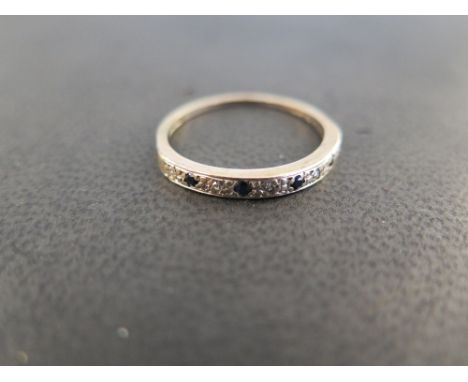 A 9ct gold sapphire and diamond band ring - Hallmarked London - Ring size V 1/2 - Weight approx 2.3gms
Condition Report: Fair