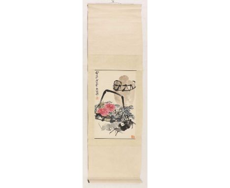 A Chinese hanging scroll,20th century, painted with crabs by a basket of chrysanthemum, inscribed with the signature and arti