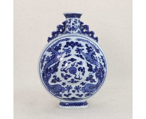 A Chinese blue and white moon flask,19th-20th century, the compressed circular body rising from an oval foot, to a cylindrica