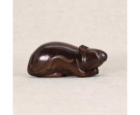 A Chinese jade carving,of a mouse, the stone of brown tone with black veined streaks, 9.5cm long玉雕老鼠把件Condition ReportEyes po