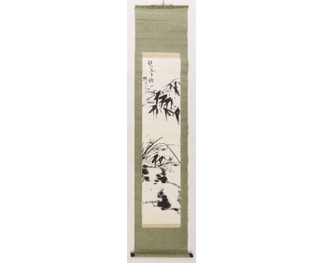 A Chinese hanging scroll,20th century, painted with bamboo and orchids, inscribed with dedication, the signature and an artis