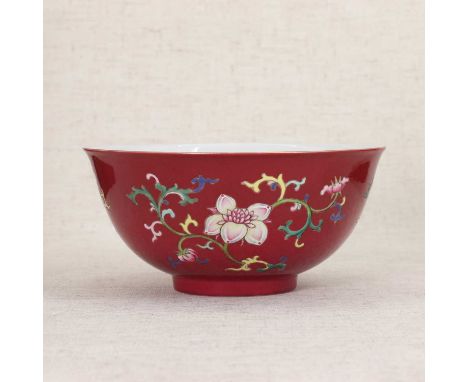 A Chinese famille rose bowl,Republic period or later, the rounded sides rising from a circular foot, painted with sprigs of f