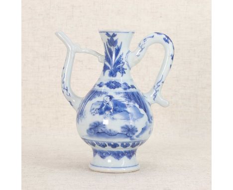 A Chinese blue and white ewer, Chongzhen (1628-1644), the pear-shaped body rising from an everted circular foot to a flared r