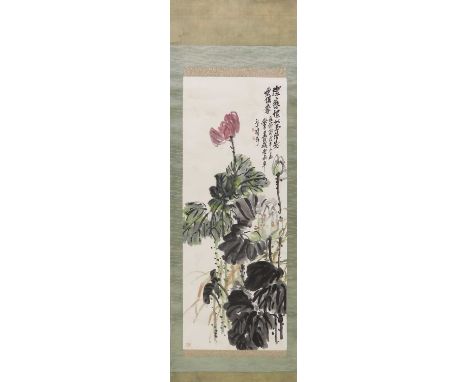 A Chinese hanging scroll,20th century, painted with lotus flowers and leaves, inscribed with the signature and artist's seals