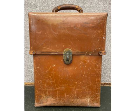 A vintage Charles King Ltd. nitrous oxide breathing apparatus and tank in a leather carry case. H.50cm 