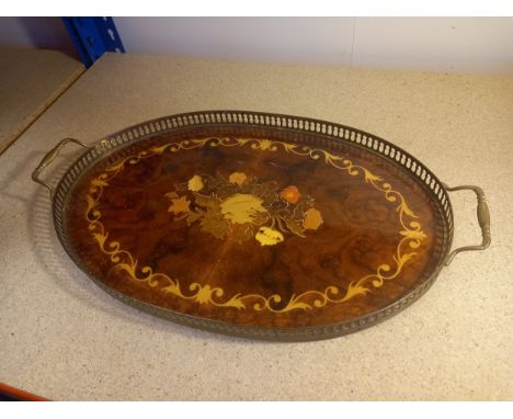 A vintage burr walnut and inlaid tray with a pierced brass surround and handles. L. 52cm 