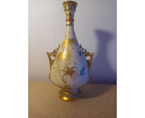 A 19th century Royal Worcester ivory blush and gilt vase with Oriental style hand painted decoration. H.27cm. 