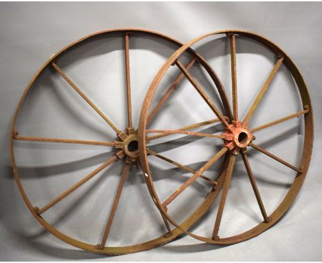 Pair of Large Cast Iron industrial or Cartwheels which measure approx 44 inches in diameter.   THIS ITEM IS TOO HEAVY TO POST