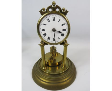 German Made Brass based Anniversary clock with enamel Dial. Sits under a Glass dome which measures approx 12 inches tall.  Ru