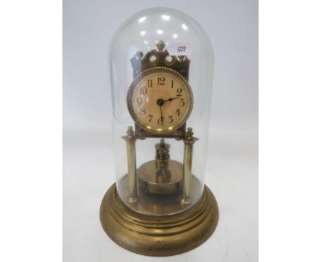 German Made Brass based Anniversary clock with enamel Dial. Sits under a Glass dome which measures approx 12 inches tall.  Ru