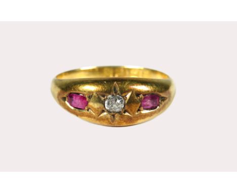 Edwardian Style 18ct Yellow Gold ring set with a central Diamond and flanked by two Rubies of Equal size.  Clear hallmarks fo