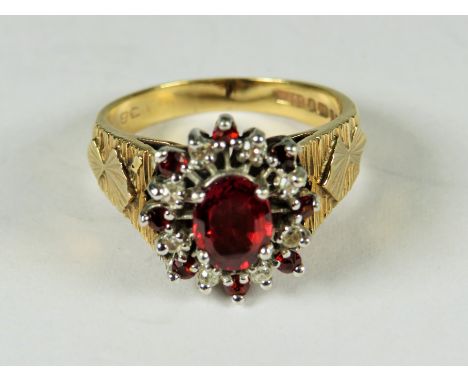 Very Large 9ct Yellow Gold ring set with a central Garnet with Diamond Cluster surround.  Finger size 'O'    4.9g