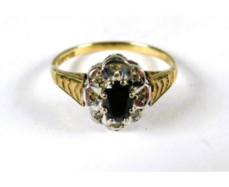 9ct Yellow Gold Ring set with a Central Sapphire with small diamond set surround .  Finger size 'N-5'   2.0g
