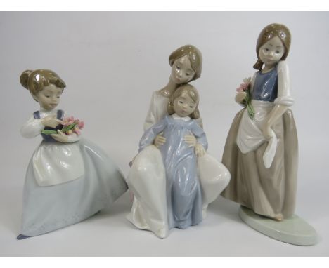 3 Nao figurines, 2 of Girls with flowers and 1 of a mother and child, the tallest measures 23cm (some chips to the flower pet