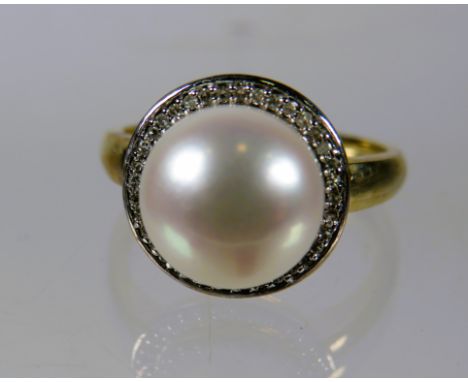 9ct Yellow Gold Ring set with a 10mm Pearl with Diamond Surround.  Finger size 'N-5'    3.5g