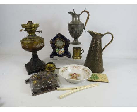 Interesting mixed lot included a Oil lamp, Vintage ceramic clock, hammered brass jug etc.