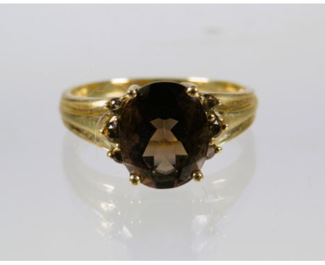 9ct Yellow Gold Ring set with a Smokey quartz (10 x 8mm ) with Melee Diamonds to shoulders. Finger size R    2.9g