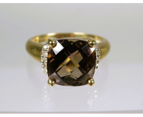 9ct Yellow Gold Ring set with Smokey Quartz (10 x 10 mm) and Melee Diamonds to the sides.  Finger size P     3.2g