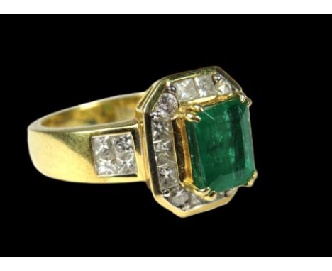 18ct Yellow Gold Art Deco Style Ring set with an amazing Central Emerald of approx 1.84pts and has surrounding Diamonds total