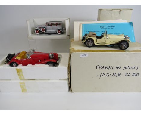 Franklin Mint diecast Mercedes and Jaguar plus one other vehicle all with boxes.