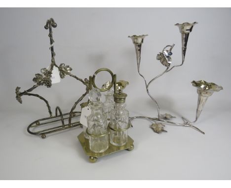 Silver plated cruet set, Epergne vase and a white metal bottle holder.