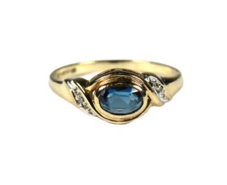 9ct Yellow Gold Ring set with a central Oval Topaz with Diamonds to shoulders.  Finger size 'O'   1.7g  
