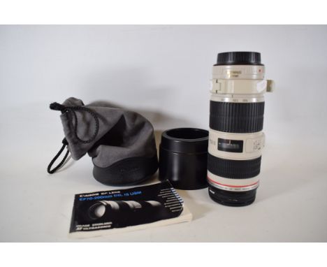 Canon EF 70/200mm Lens F/4L   Complete with Bags , lens caps and instruction manual. See photos. 