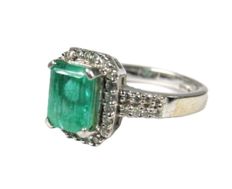 900 Platinum Ring set with a large Central Emerald of approx 2.16 cts and surrounded by Multiple Diamonds of approx 0.34pts  