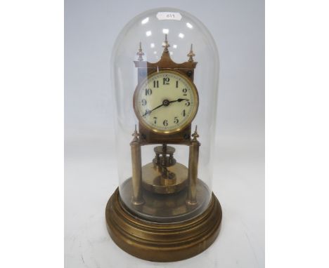 Gustav Becker Brass based Anniversary Clock under a Glass dome. Running order but no key present. Measures approx 12 inches t
